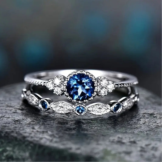 Conjunto Dois Anéis Pedra Azul-Escura e Navetes
