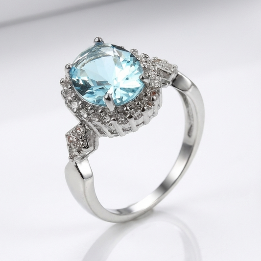 Anel Oval Azul-Claro com Orla de Pedrinhas