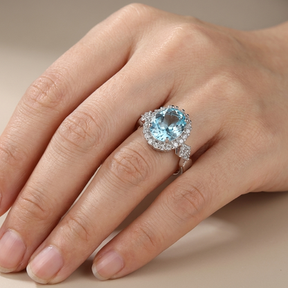 Anel Oval Azul-Claro com Orla de Pedrinhas