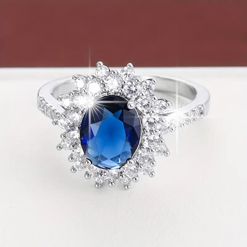 Anel Oval Azul-Escuro com Sol de Pedrinhas