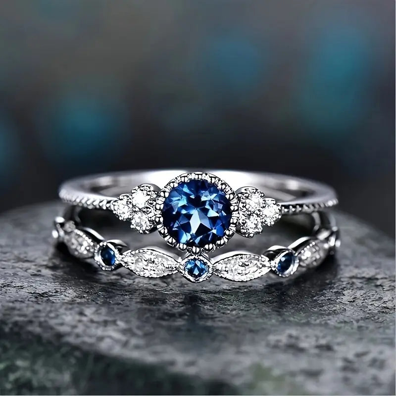Conjunto Dois Anéis Pedra Azul-Escura e Navetes