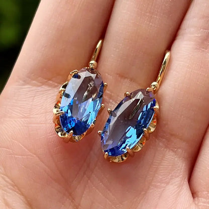 Brincos Pedra Azul Oval em Moldura Ondulada