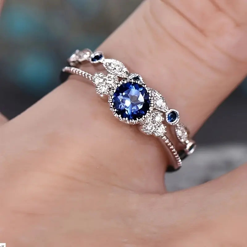 Conjunto Dois Anéis Pedra Azul-Escura e Navetes